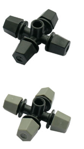 Assorted black plastic pipe fittings including cross and elbow connectors